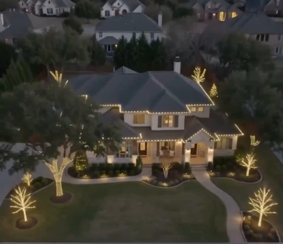 Aerial view of an estate home in an everyday warm white scene