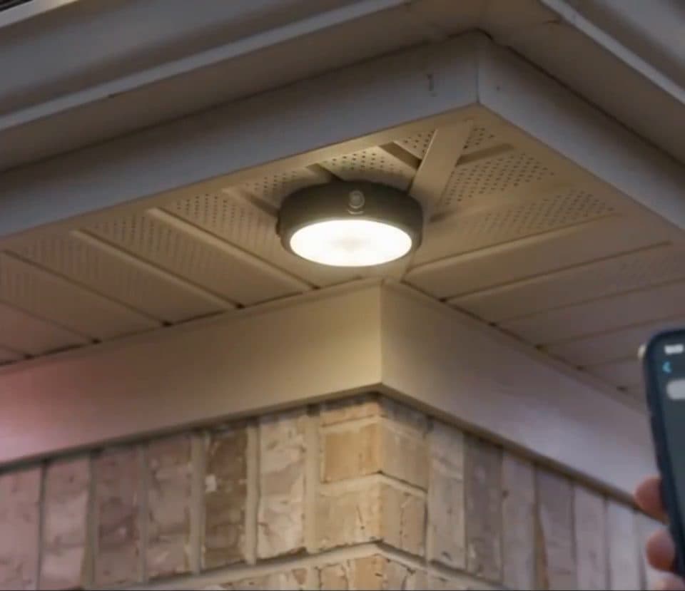 Close-up of the low-profile LED fixture tucked under the soffit